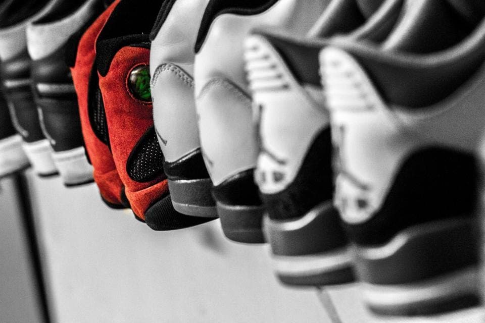 A thin-soled shoe bent in half to show sole flexibility